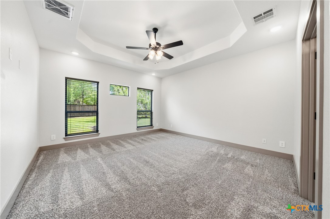 2892 Beulah Boulevard Belton, TX 76513 - Photo 13 of 47 an empty room with windows and fan