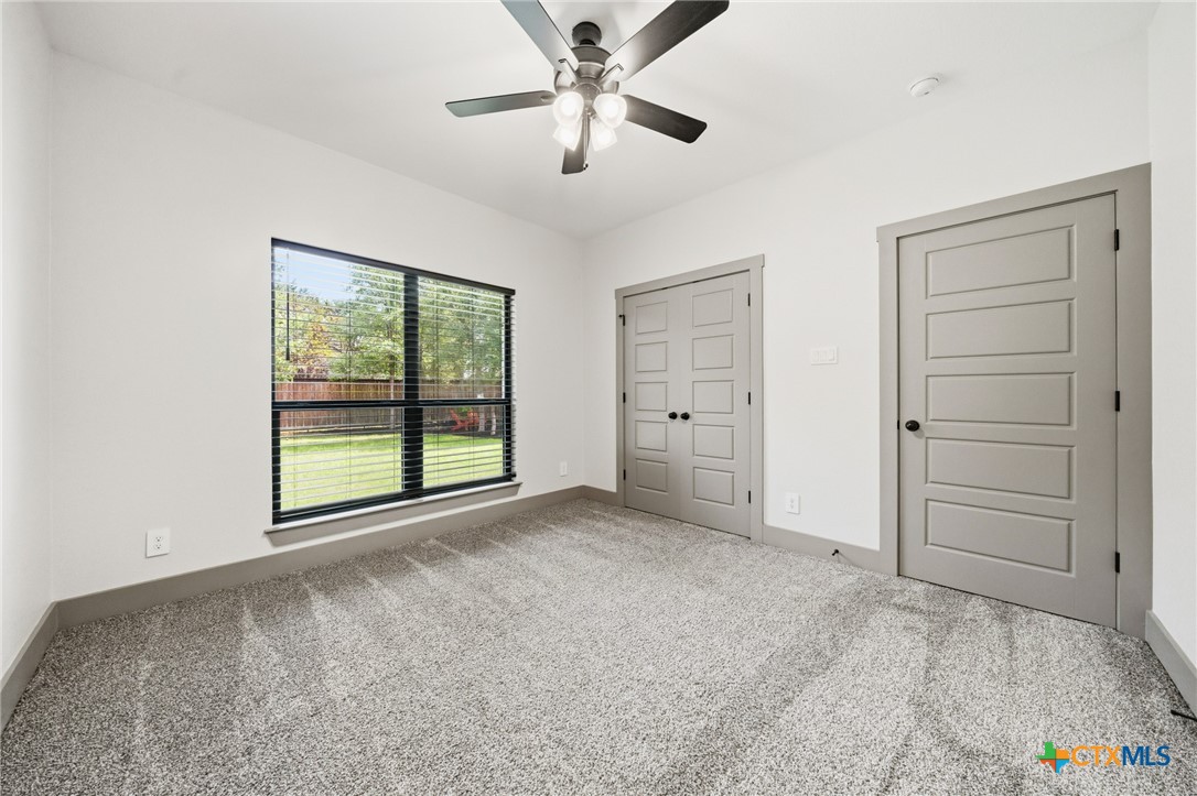 2892 Beulah Boulevard Belton, TX 76513 - Photo 24 of 47 a view of a room with cabinet and a ceiling fan