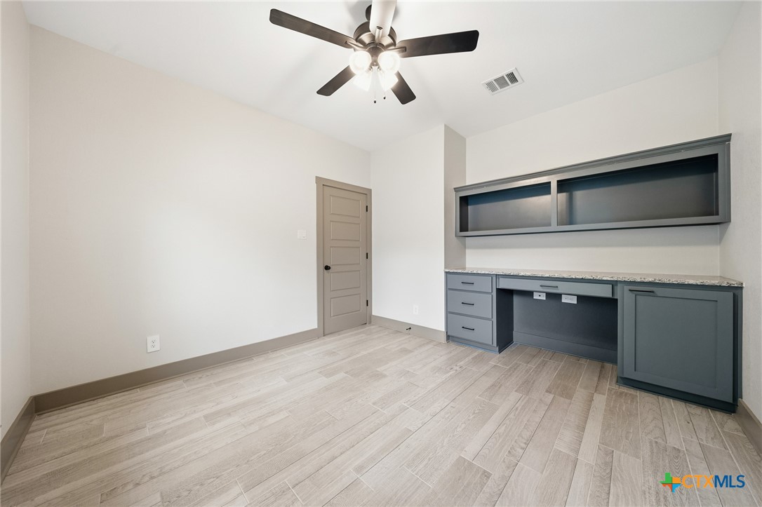2892 Beulah Boulevard Belton, TX 76513 - Photo 26 of 47 a view of a kitchen with a sink and a refrigerator