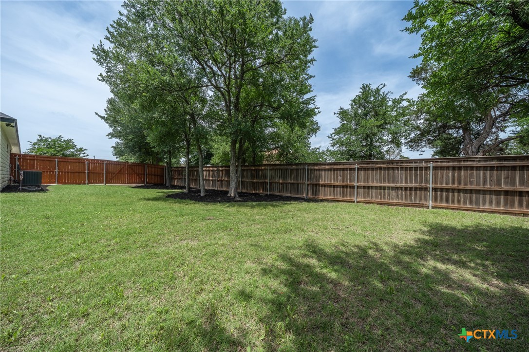 2892 Beulah Boulevard Belton, TX 76513 - Photo 37 of 47 a view of a yard with a wooden fence