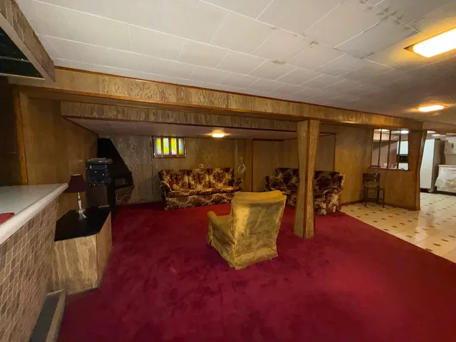 a view of game room with windows