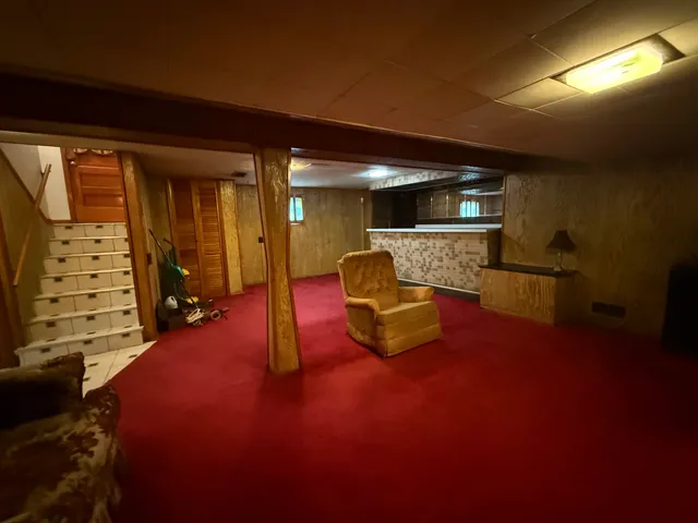 a kitchen with granite countertop appliances a sink and a refrigerator