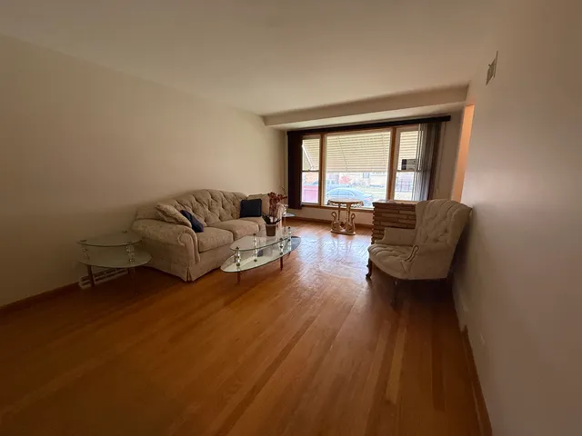 a kitchen with stainless steel appliances a sink a counter top space cabinets and a window