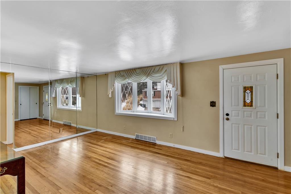 2 Hallmark Drive Pittsburgh, PA 15235 - Photo 7 of 32 Front Door Opens into Spacious 20x12 Living Room with Gorgeous Hardwood Floors and Spacious Coat Closet.