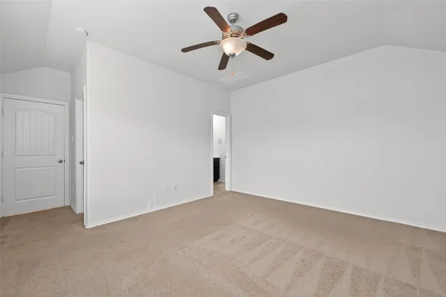 a view of a livingroom with a ceiling fan and window