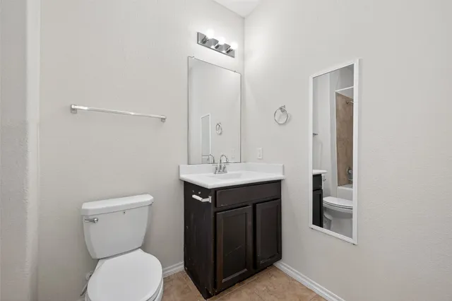 a bathroom with a sink a toilet and a bathtub