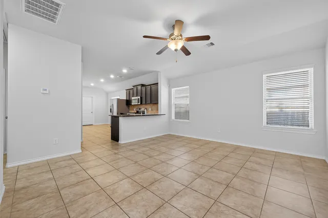 a view of kitchen with furniture and window