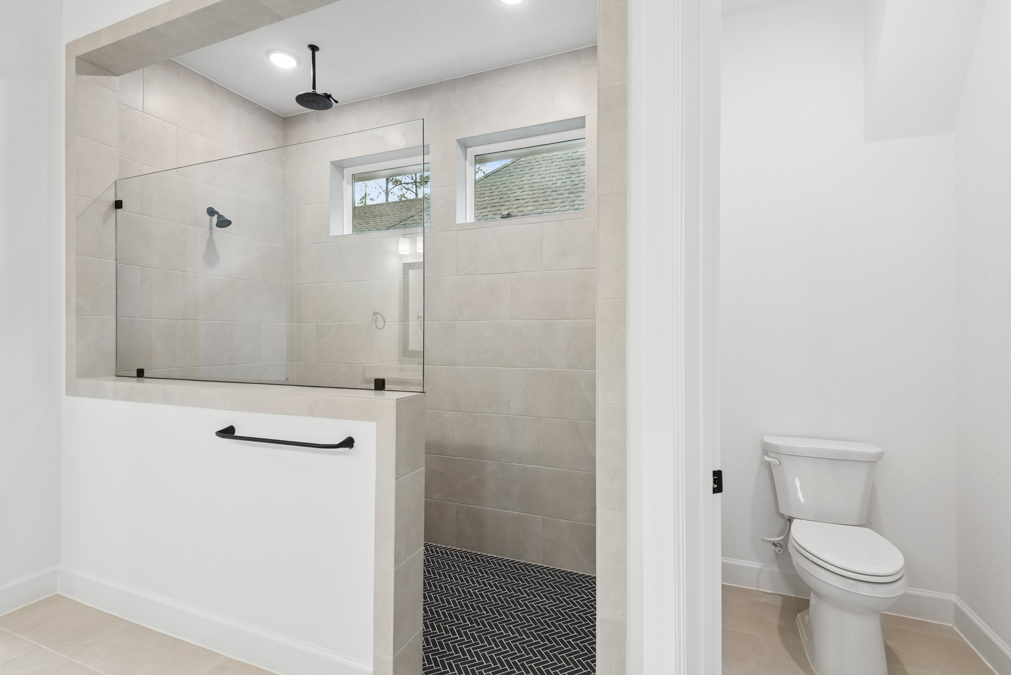 15714 Terracotta Terrace Lane Conroe, TX 77302 - Photo 40 of 47 a bathroom with a shower a toilet and a sink