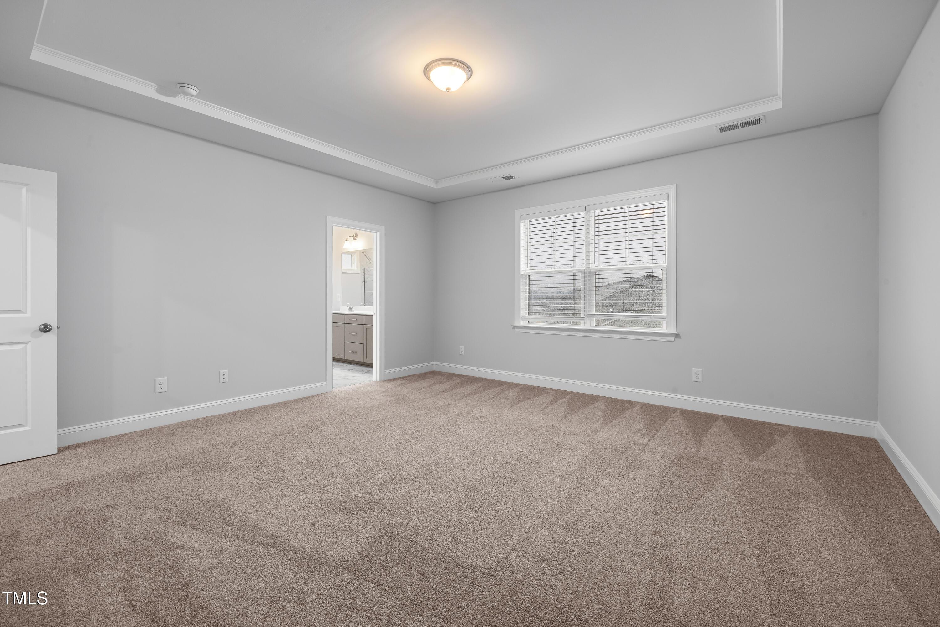 2005 Mavin Place Durham, NC 27703 - Photo 12 of 26 an empty room with windows and closet