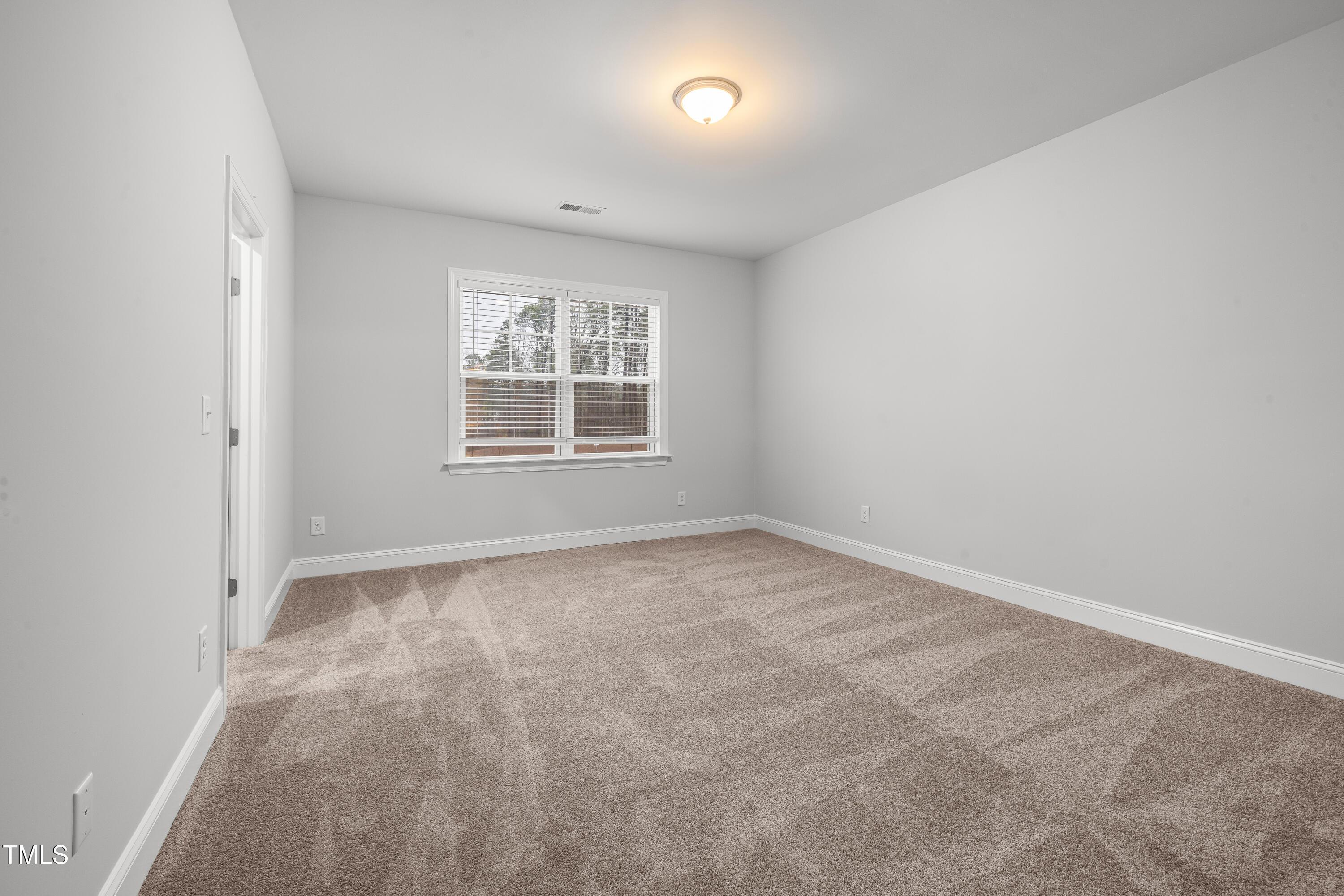 2005 Mavin Place Durham, NC 27703 - Photo 16 of 26 an empty room with a window