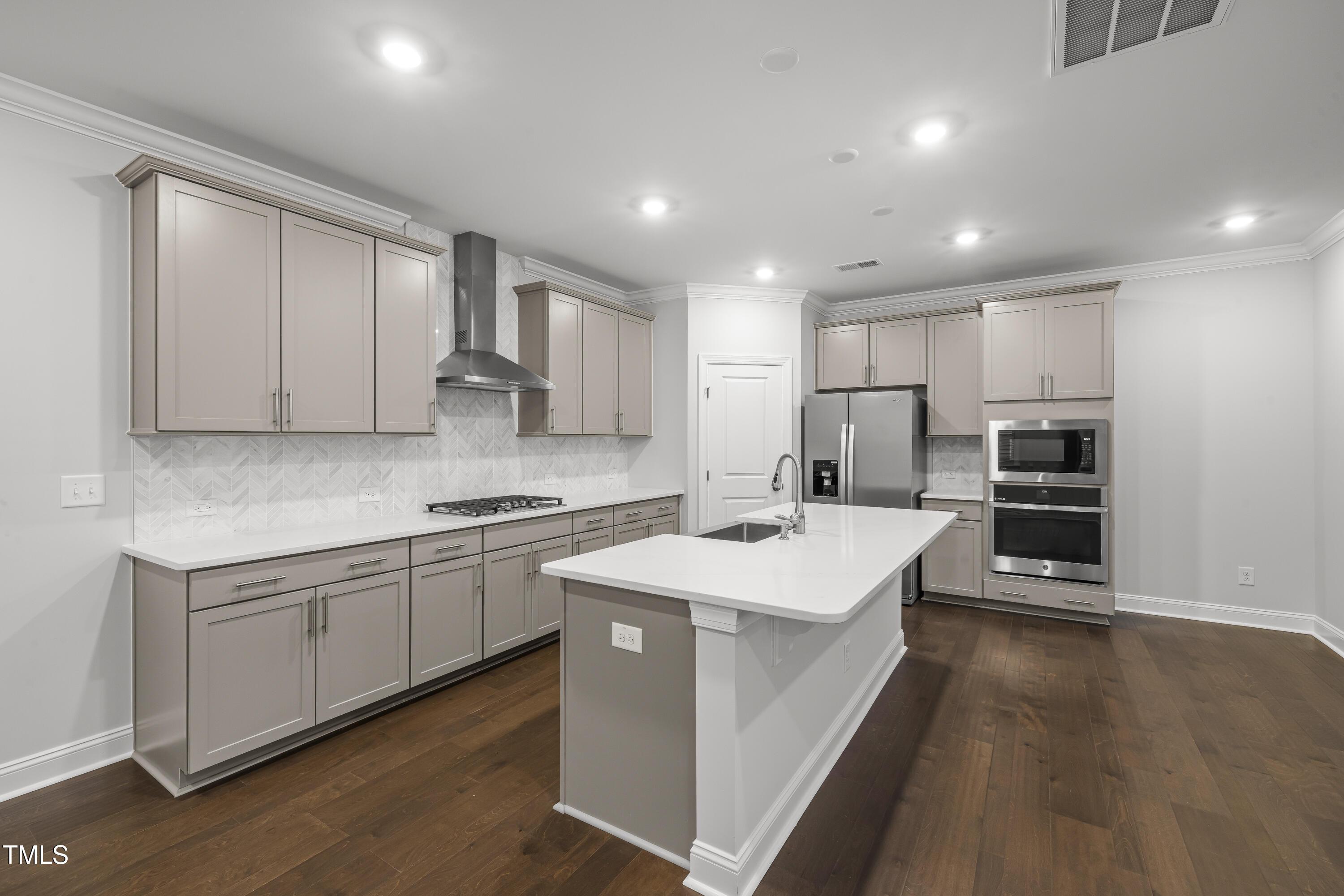 2005 Mavin Place Durham, NC 27703 - Photo 4 of 26 a kitchen with a sink stove and cabinets