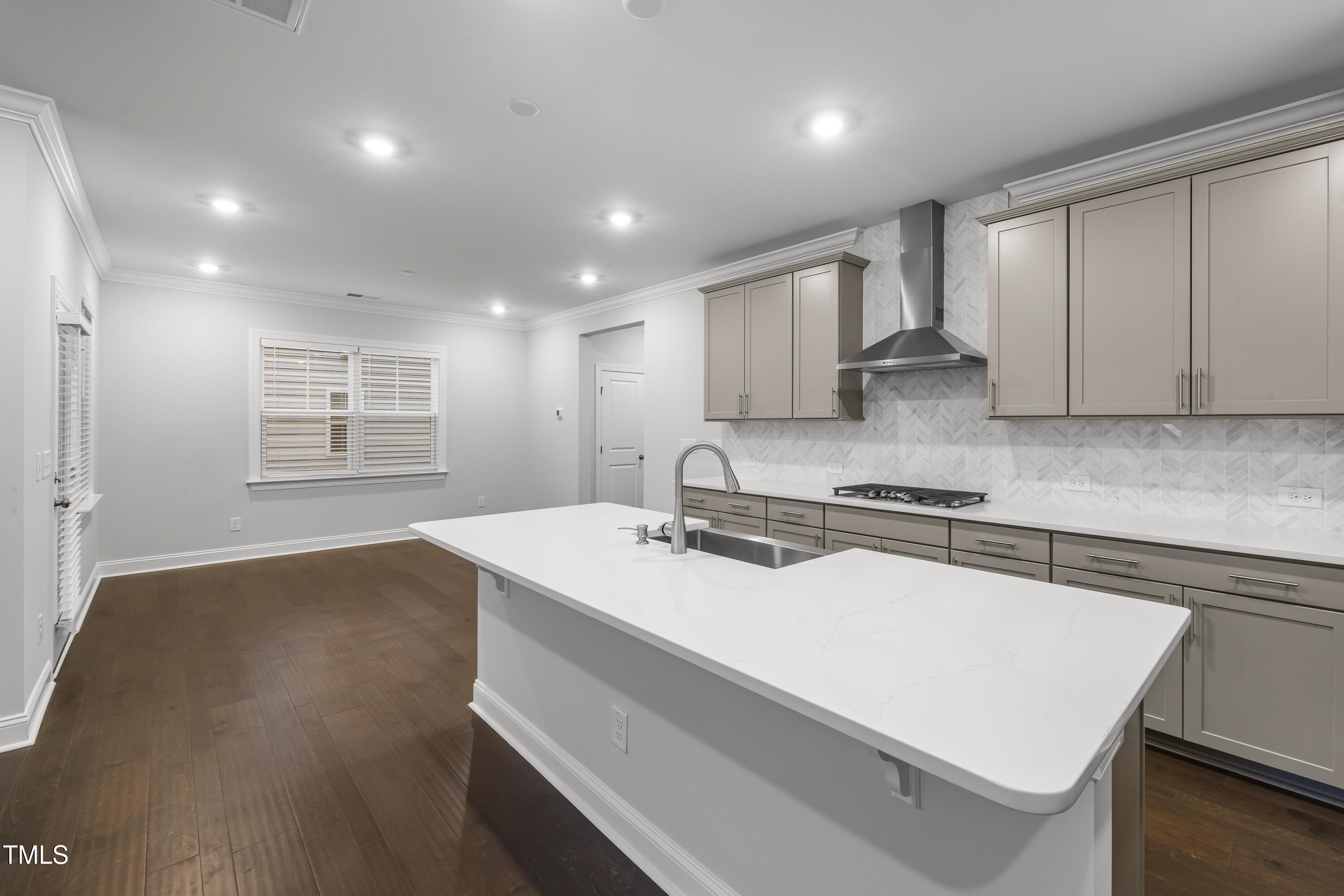 2005 Mavin Place Durham, NC 27703 - Photo 7 of 26 a kitchen with a sink a stove a refrigerator and cabinets