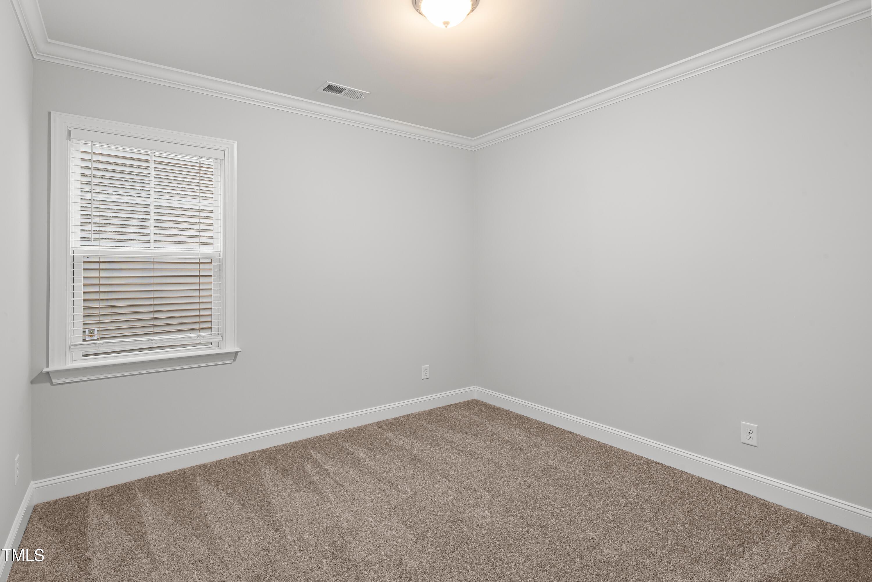 2005 Mavin Place Durham, NC 27703 - Photo 9 of 26 an empty room with a window