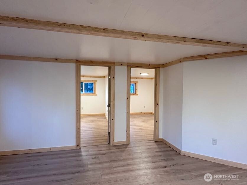 10341 184th Avenue Southwest Rochester, WA 98579 - Photo 29 of 36 a view of empty room with wooden floor