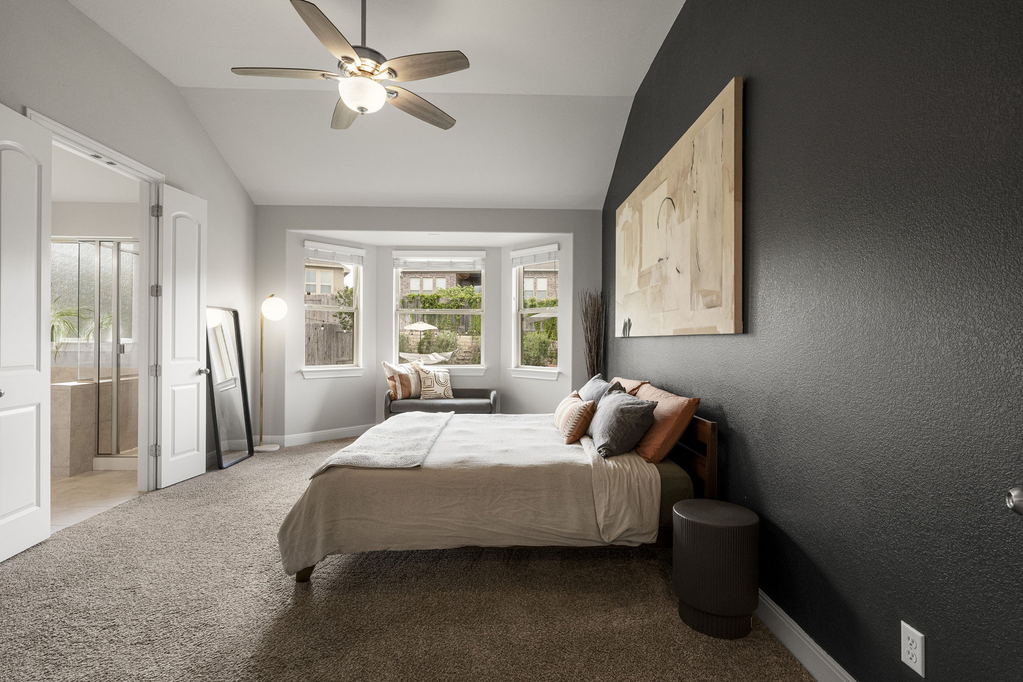 772 Founders Ridge Dripping Springs, TX 78620 - Photo 6 of 40 The spacious primary suite is secluded toward the back of the house and offers a quiet retreat overlooking the beautifully landscaped backyard.