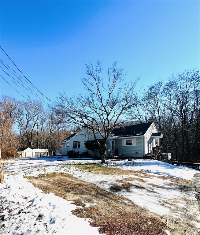 214-216 River Road East Berlin, MA 01503 - Photo 2 of 16 a view of a house with snow on the road
