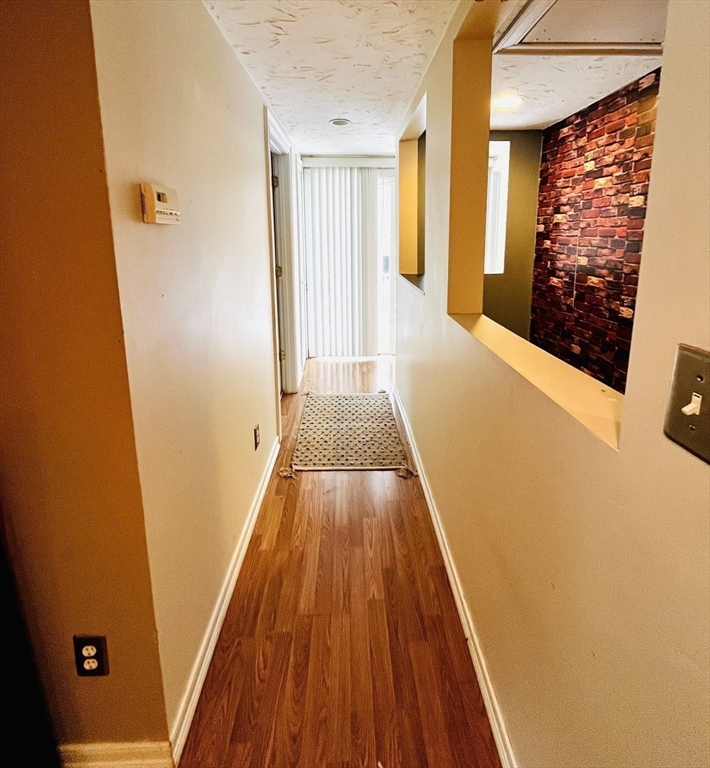 214-216 River Road East Berlin, MA 01503 - Photo 6 of 16 a view of a hallway with wooden floor and staircase