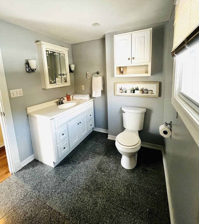 214-216 River Road East Berlin, MA 01503 - Photo 7 of 16 a bathroom with a toilet sink and mirror