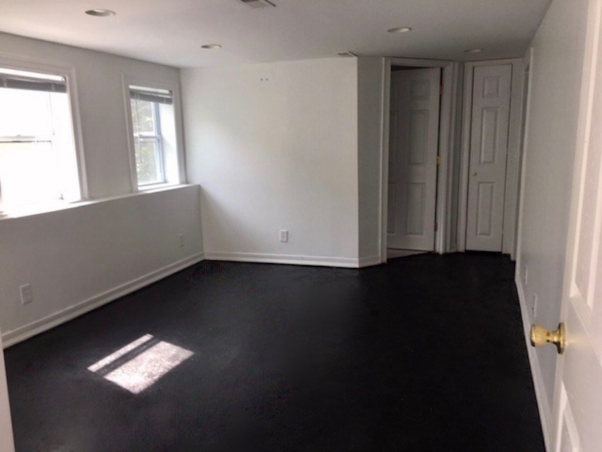 214-216 River Road East Berlin, MA 01503 - Photo 10 of 16 an empty room with wooden floor and windows
