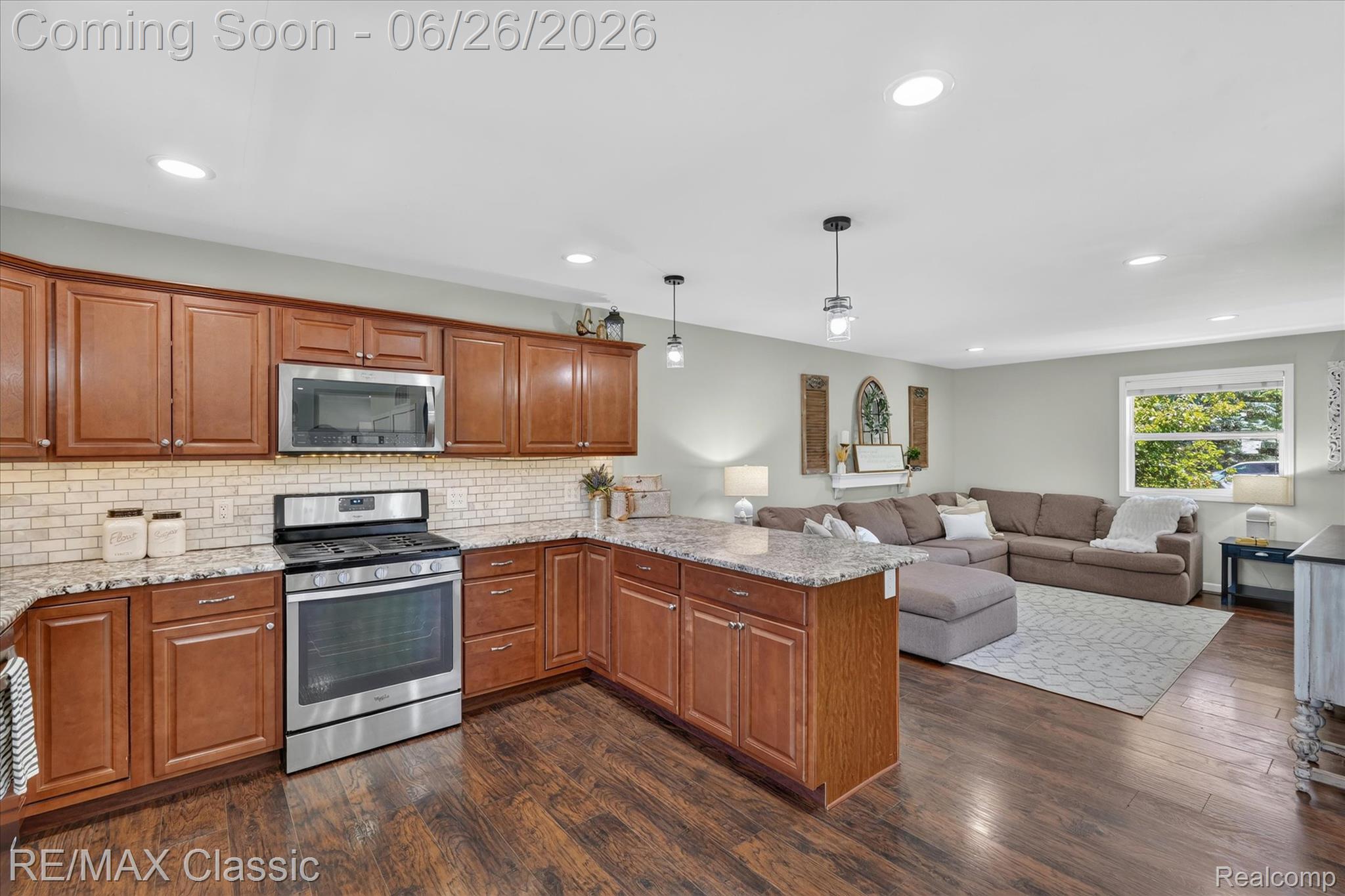 3205 North Milford Road Highland, MI 48357 - Photo 13 of 53 Kitchen featuring wood-finish cabinetry, stainless steel appliances, and granite countertops