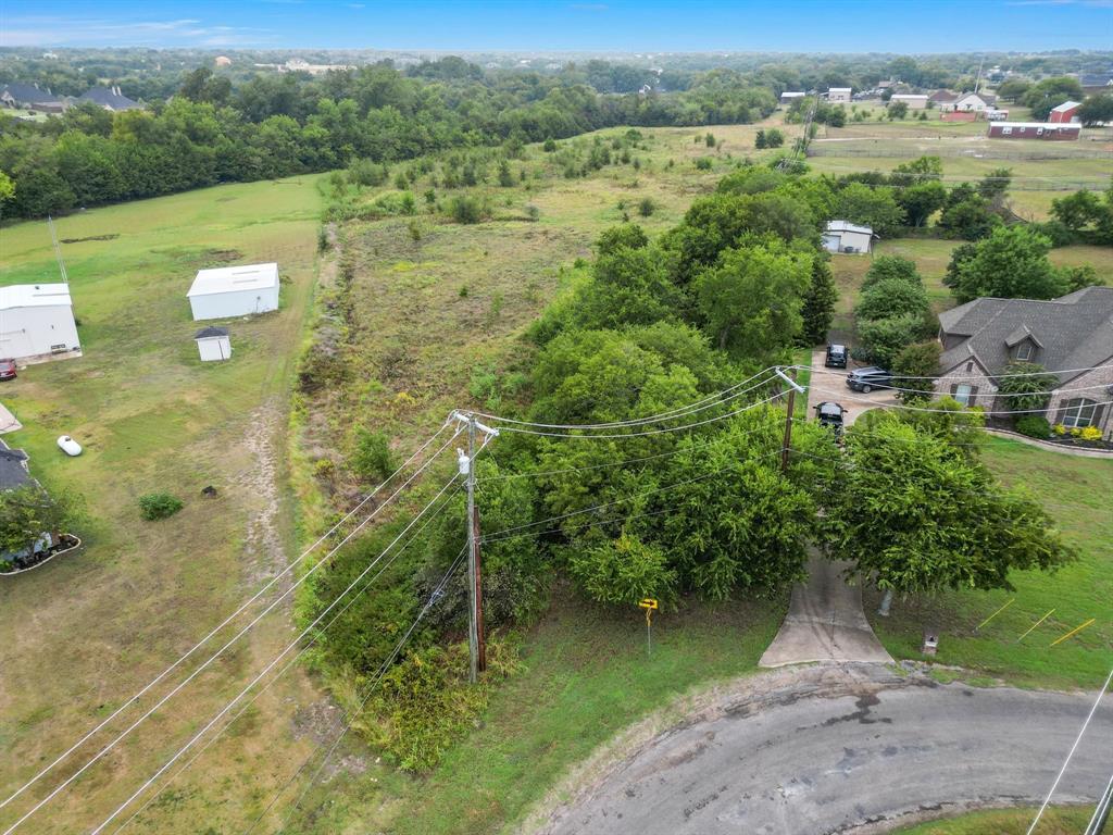 1061 Blackchamp Road Waxahachie, TX 75167 - Photo 2 of 22 an aerial view of green landscape with trees houses and grass