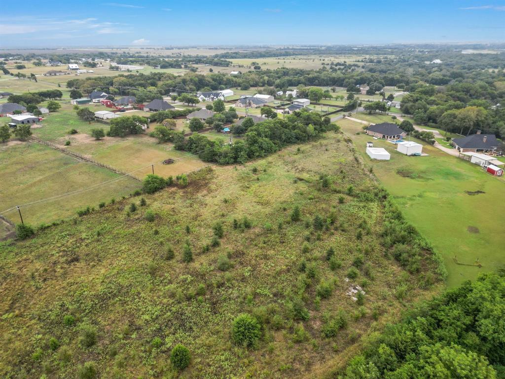 1061 Blackchamp Road Waxahachie, TX 75167 - Photo 7 of 22 an aerial view of residential houses with outdoor space and trees