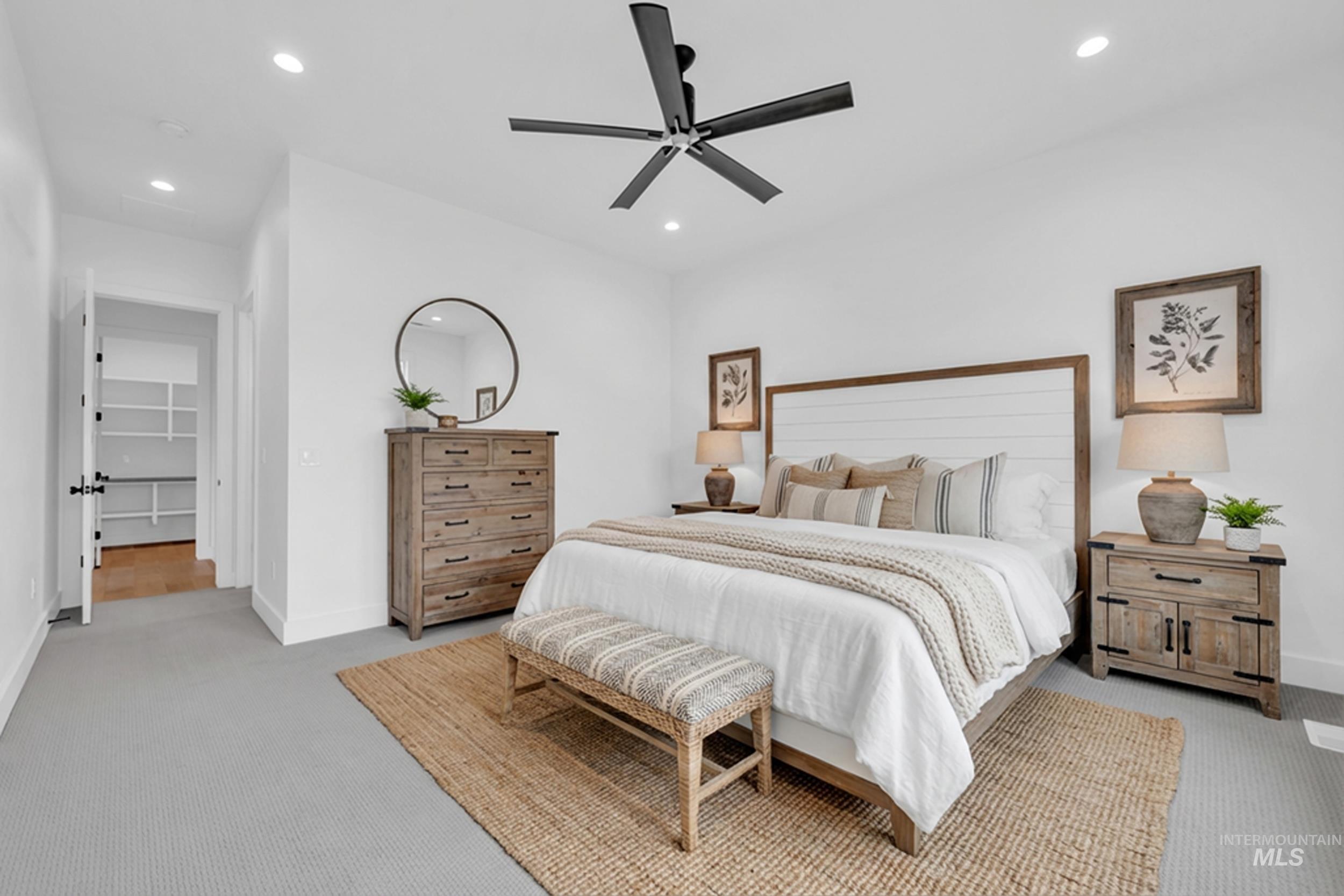 4447 East Copper Point Drive Meridian, ID 83642 - Photo 19 of 42 Bedroom featuring light colored carpet, ceiling fan, and recessed lighting