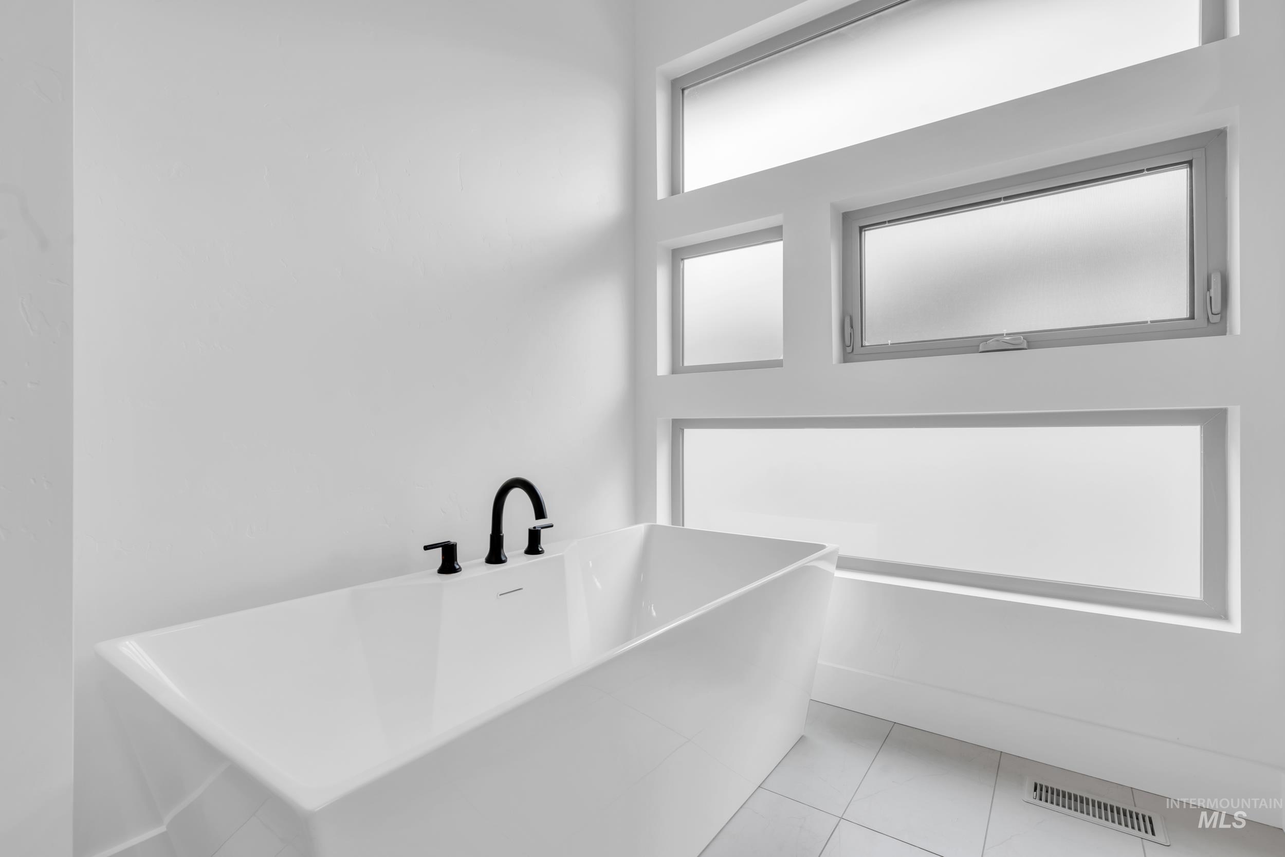 4447 East Copper Point Drive Meridian, ID 83642 - Photo 24 of 42 Bathroom featuring a freestanding bath