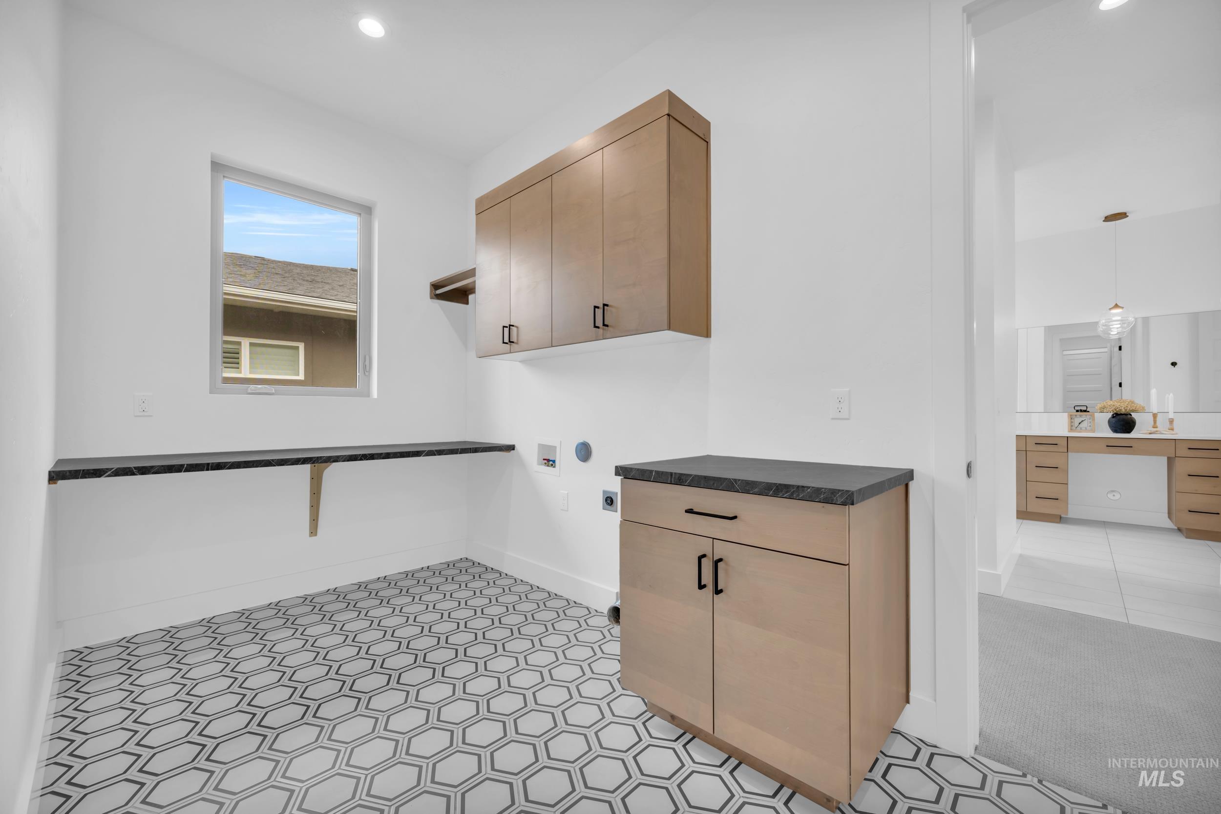 4447 East Copper Point Drive Meridian, ID 83642 - Photo 27 of 42 Laundry area with washer hookup, cabinet space, recessed lighting, and electric dryer hookup
