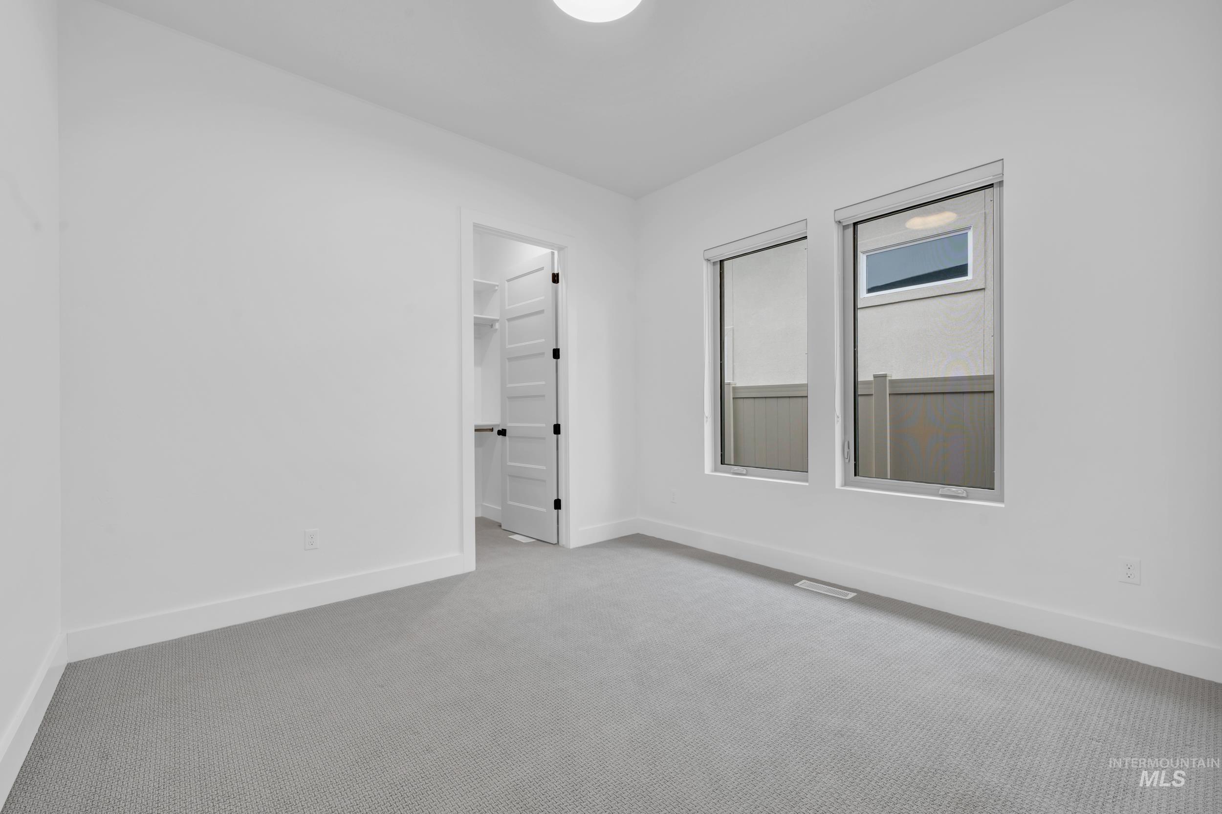 4447 East Copper Point Drive Meridian, ID 83642 - Photo 34 of 42 Spare room featuring baseboards and carpet floors