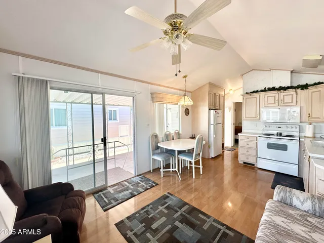 a front view of a house with a yard and tree s