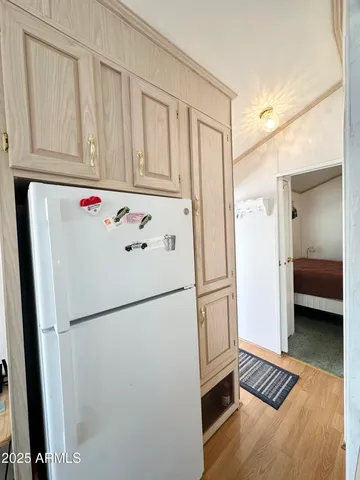 a kitchen with a stove a sink and a refrigerator