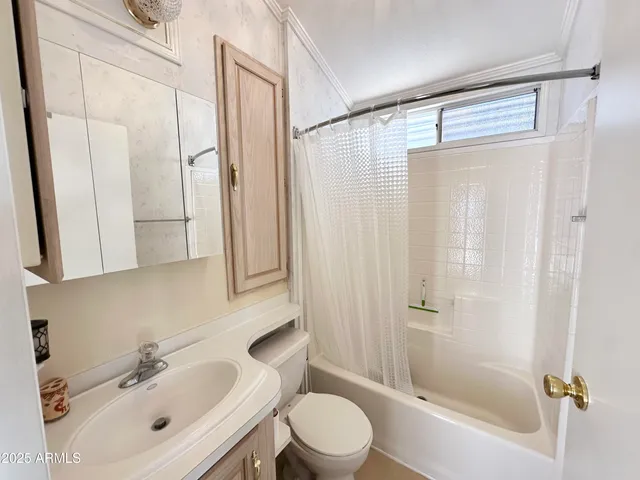 a bedroom with a bed and a view of bathroom