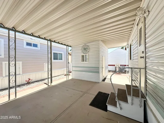 a view of an empty room and a window