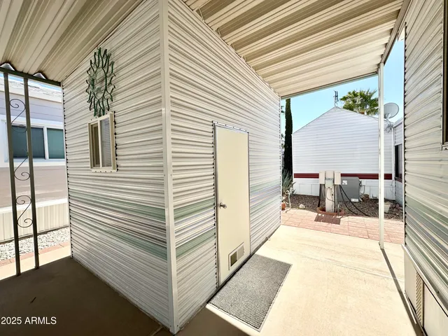 a view of a balcony with chairs