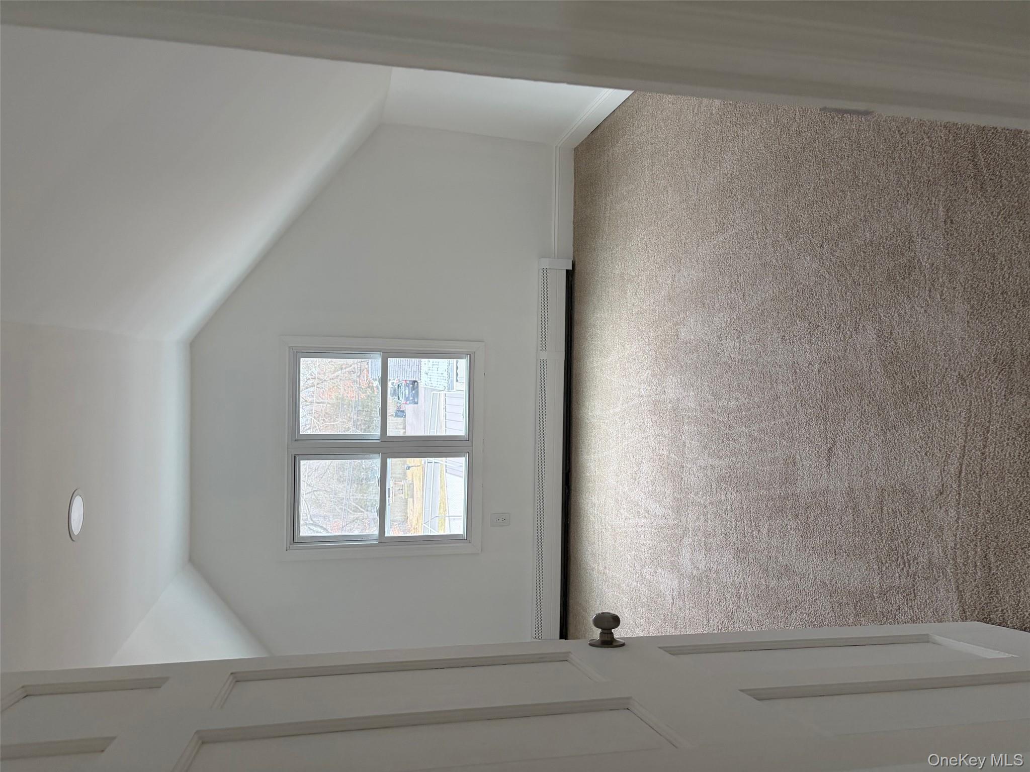 182 Lexington Road Shirley, NY 11967 - Photo 11 of 16 an empty room with a window