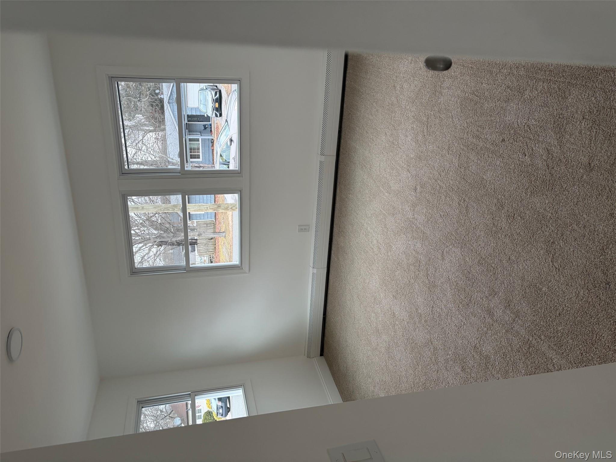 182 Lexington Road Shirley, NY 11967 - Photo 13 of 16 an empty room with windows