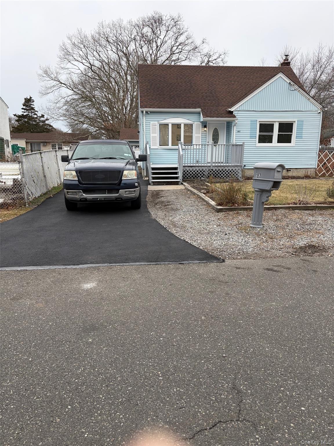 182 Lexington Road Shirley, NY 11967 - Photo 16 of 16 a view of a car parked in front of a house