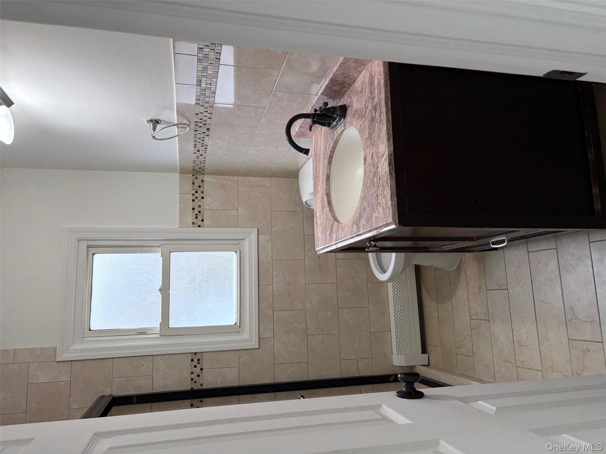 182 Lexington Road Shirley, NY 11967 - Photo 10 of 16 a bathroom with a granite countertop sink a toilet and a mirror
