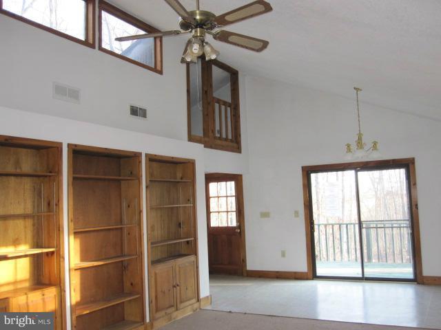358 Getaway Road Hedgesville, WV 25427 - Photo 11 of 23 Living Room with built in book shelves & DR