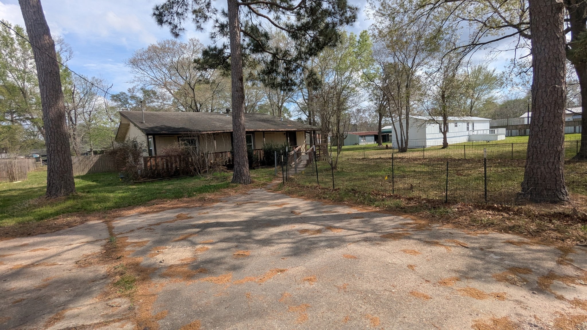 24571 Vale Lane Porter, TX 77365 - Photo 2 of 10 a view of a house with a yard