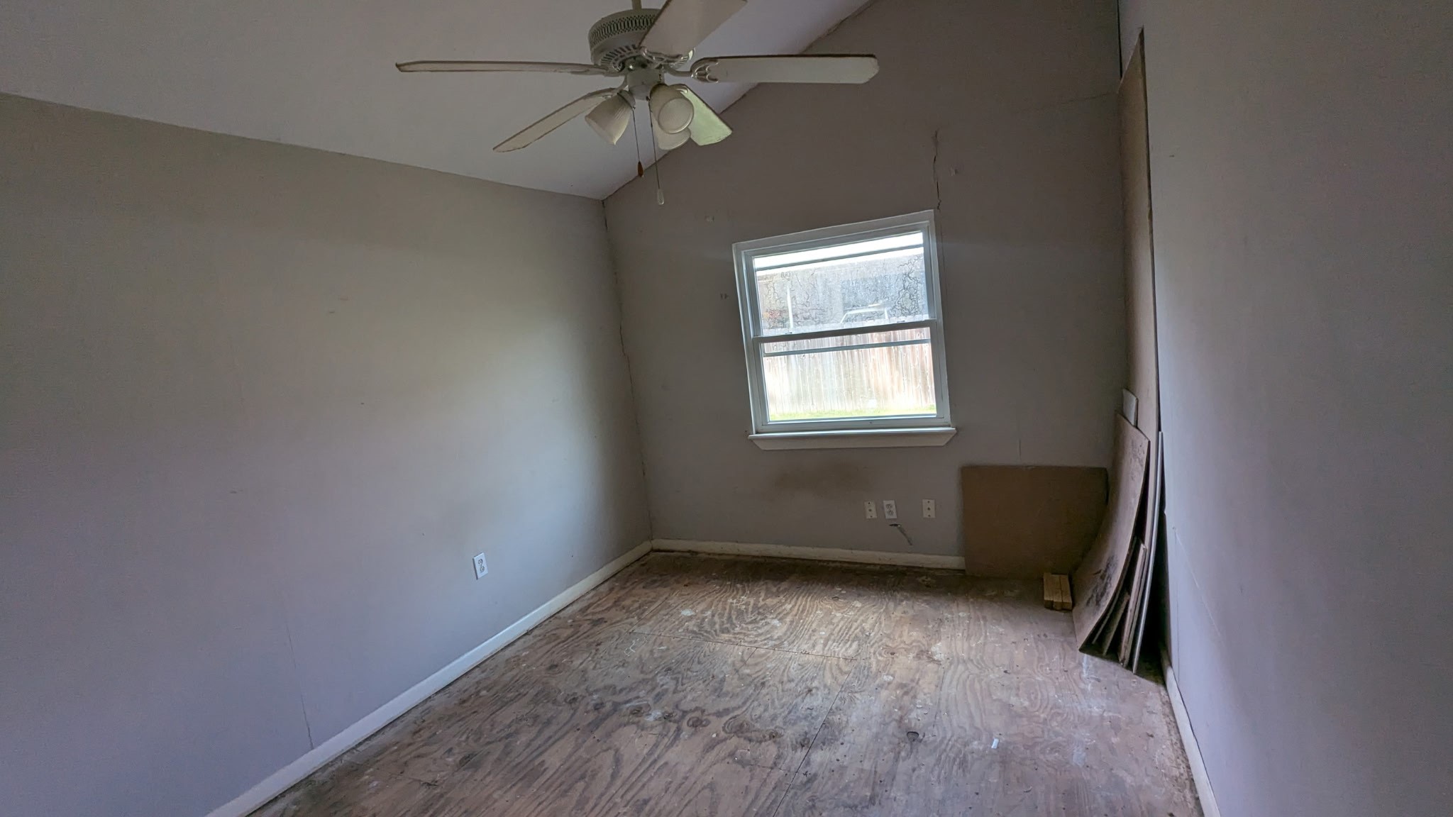 24571 Vale Lane Porter, TX 77365 - Photo 9 of 10 an empty room with windows and fan