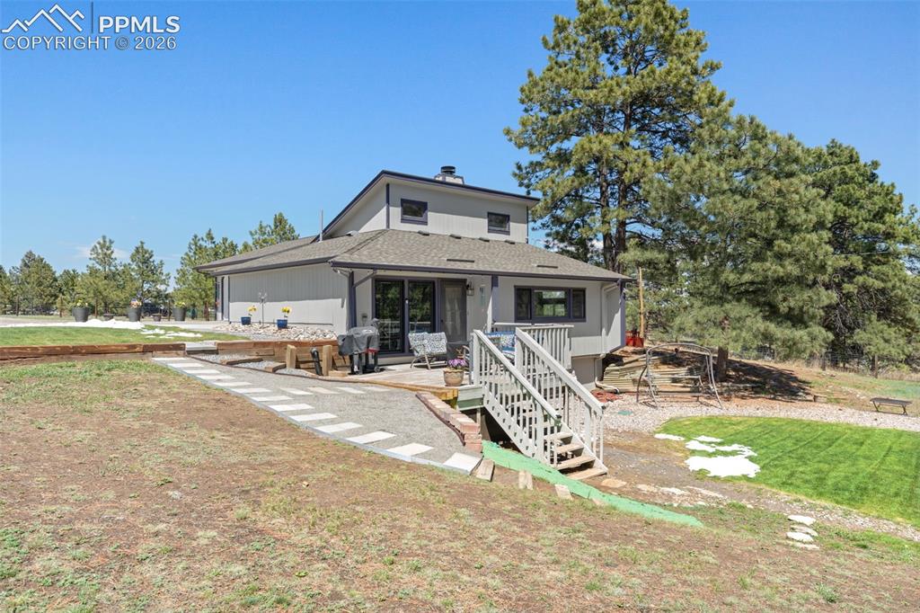 1851 Buttercup Road Elizabeth, CO 80107 - Photo 37 of 47 a view of a house with backyard and sitting area