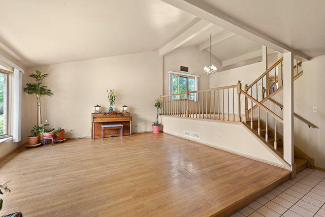 2174 Cimarron Way Addison, IL 60101 - Photo 5 of 19 a view of a livingroom with furniture and staircase