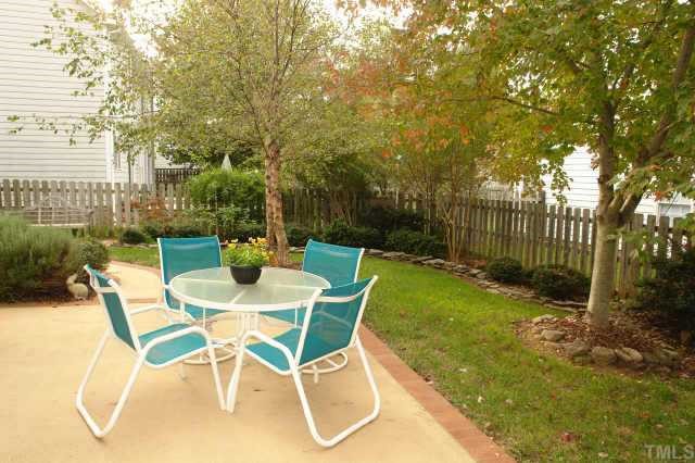 5300 Blakeley Lane Raleigh, NC 27613 - Photo 11 of 12 a view of a chairs and table in backyard