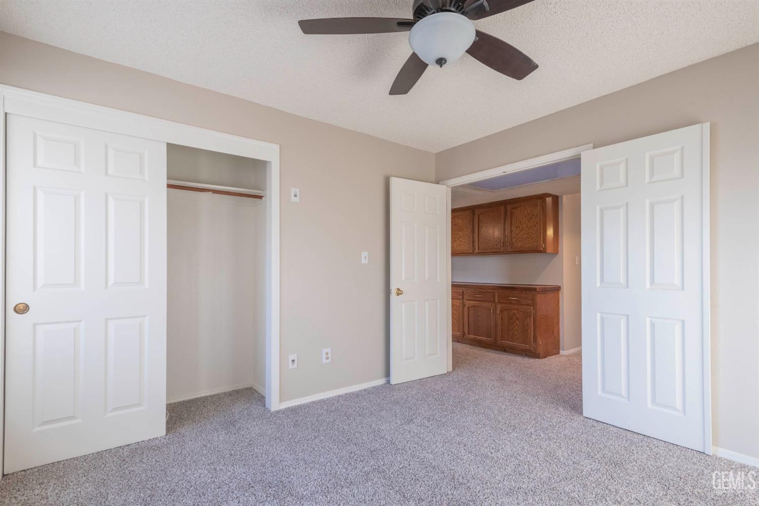 Undisclosed Address Bakersfield, CA 93314 - Photo 16 of 31 a view of an empty room and a ceiling fan