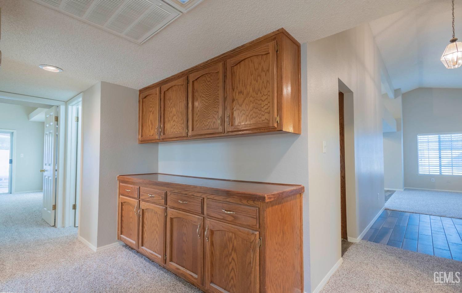 Undisclosed Address Bakersfield, CA 93314 - Photo 17 of 31 a view of cabinets with wooden floor