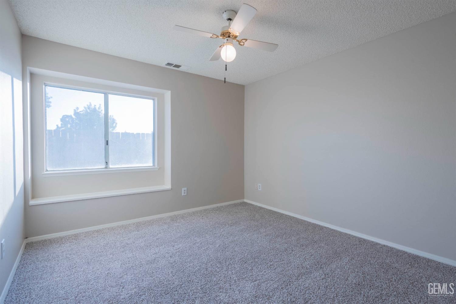 Undisclosed Address Bakersfield, CA 93314 - Photo 18 of 31 a view of an empty room with a window