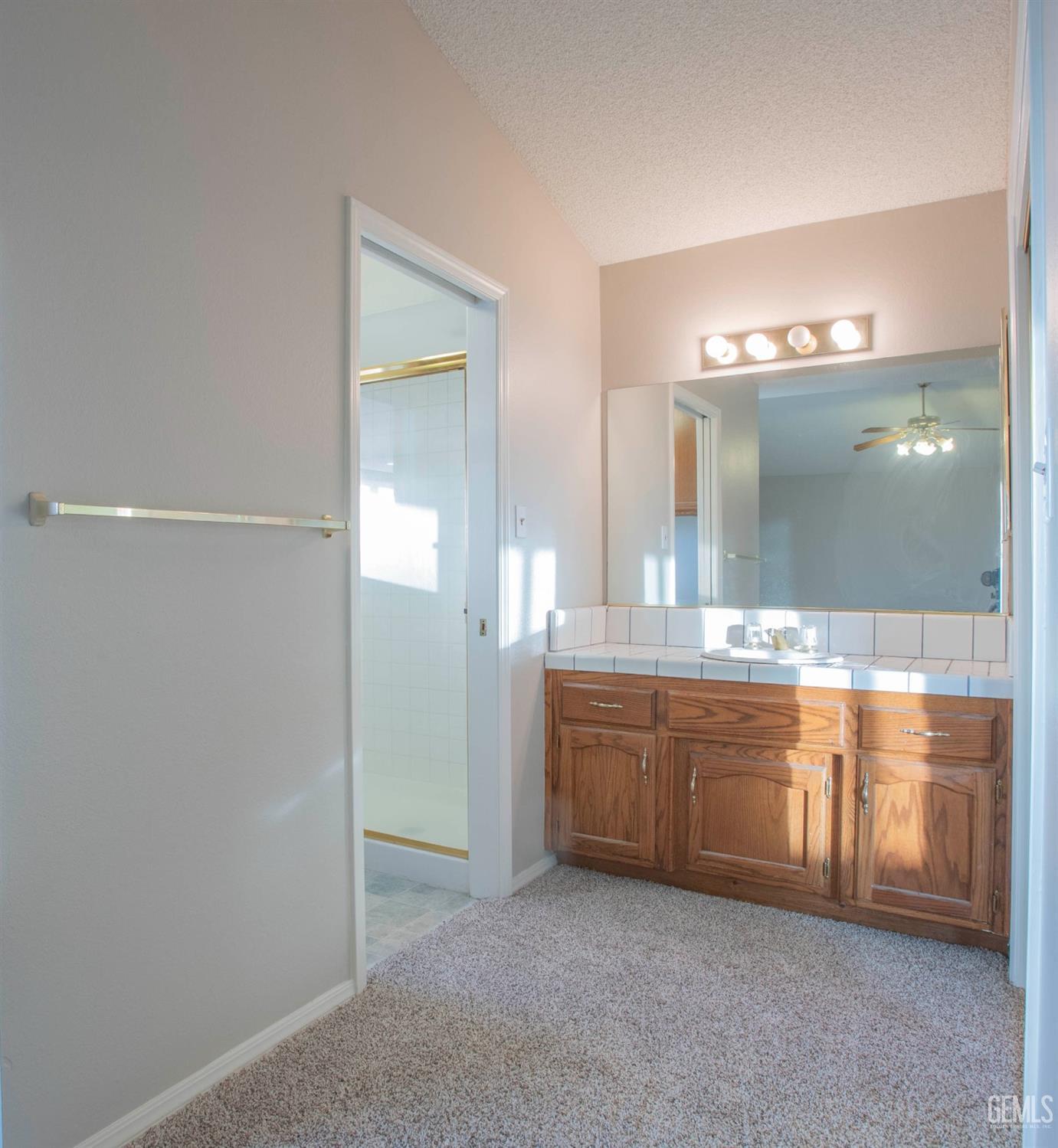 Undisclosed Address Bakersfield, CA 93314 - Photo 23 of 31 a bathroom with a granite countertop sink and a mirror
