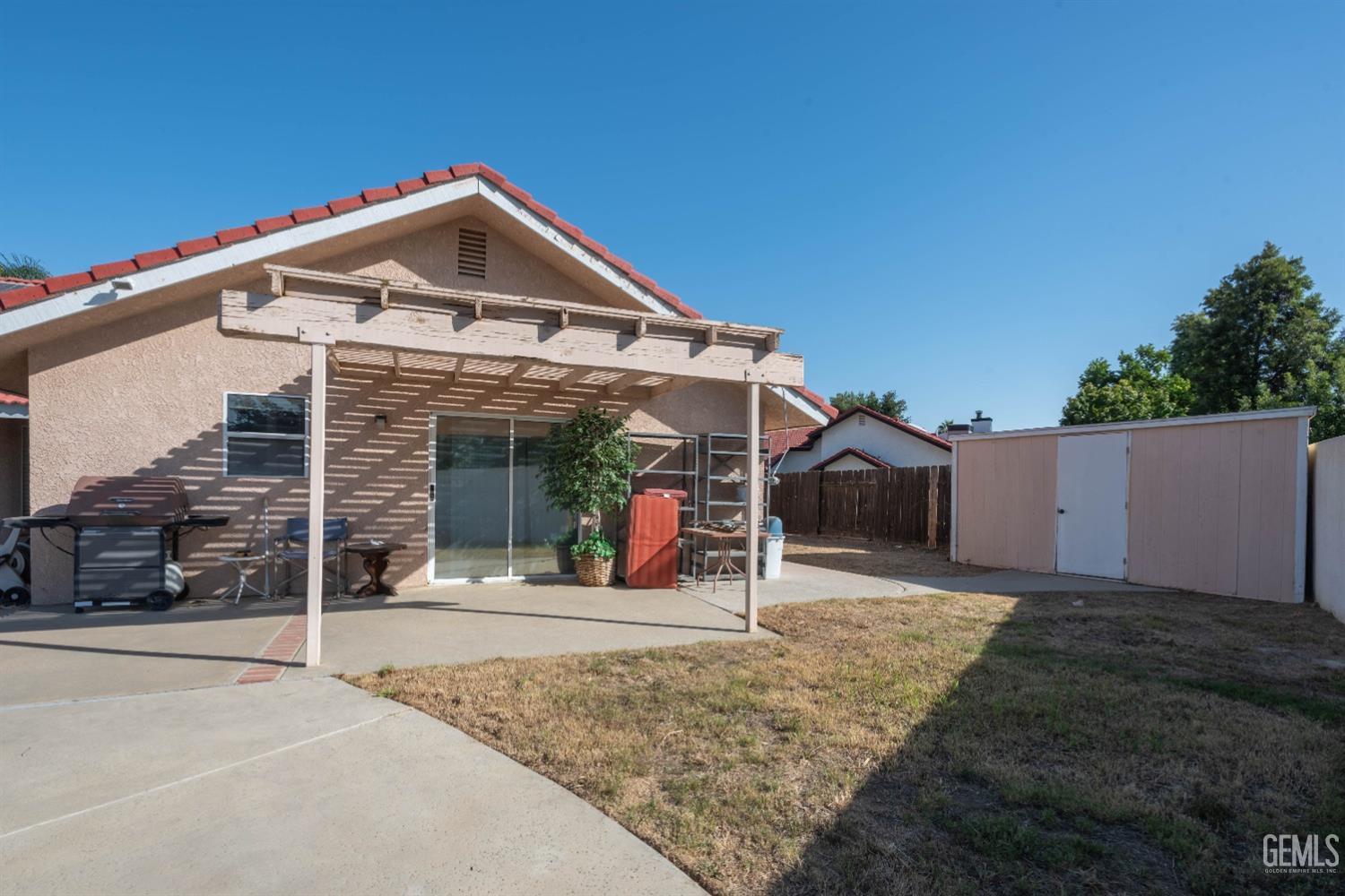 Undisclosed Address Bakersfield, CA 93314 - Photo 26 of 31 a front view of a house with a yard